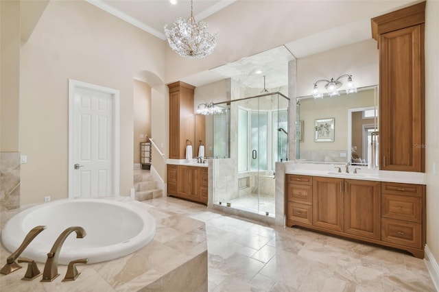 bathroom featuring vanity, separate shower and tub, and crown molding