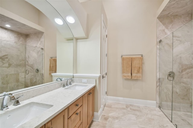 bathroom featuring vanity and an enclosed shower