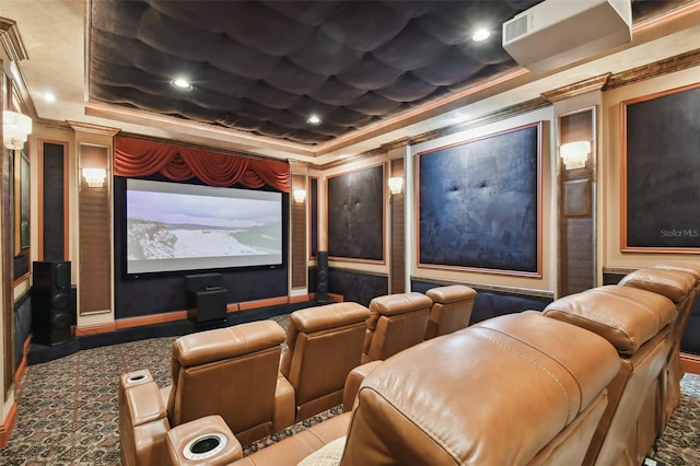 home theater with carpet, ornamental molding, and a tray ceiling