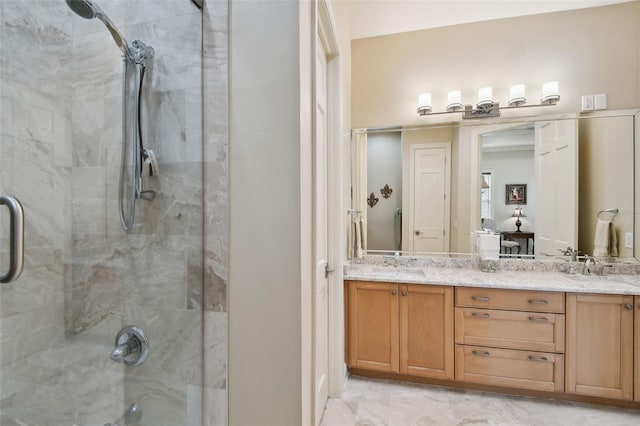 bathroom featuring vanity and a shower with shower door