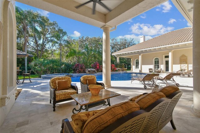 view of patio with an outdoor living space, a swimming pool with hot tub, and ceiling fan