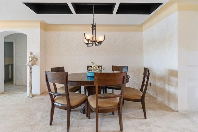 dining space featuring arched walkways