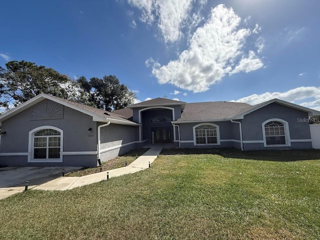 ranch-style home with a front lawn