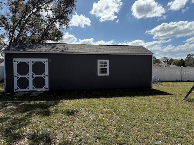 view of shed with fence