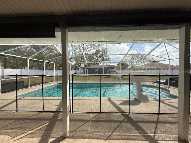 view of pool with a patio area, a fenced in pool, a lanai, and a fenced backyard