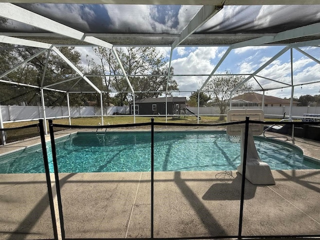 view of pool featuring a fenced in pool, a patio, a lawn, and a fenced backyard