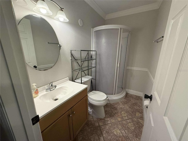 full bath featuring vanity, a shower stall, toilet, and crown molding