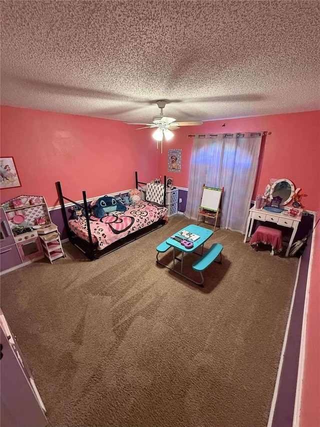 unfurnished bedroom with a textured ceiling, ceiling fan, and carpet flooring