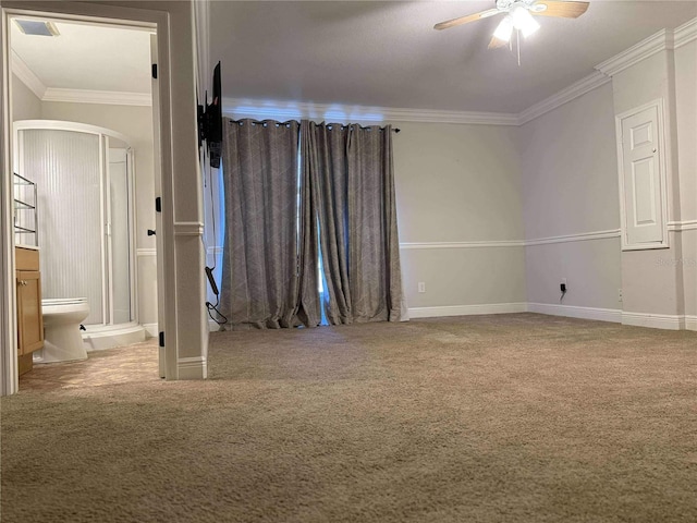 unfurnished bedroom with ensuite bath, carpet flooring, and ornamental molding