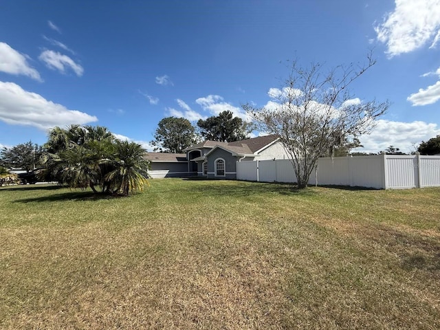 view of yard featuring fence