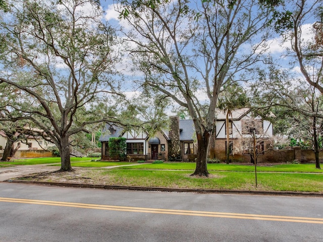 tudor house with a front yard