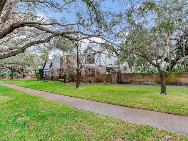 surrounding community with a lawn