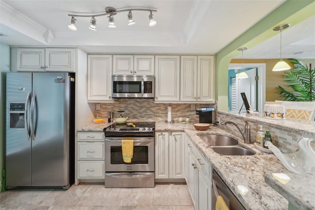 kitchen featuring tasteful backsplash, stainless steel appliances, crown molding, sink, and pendant lighting