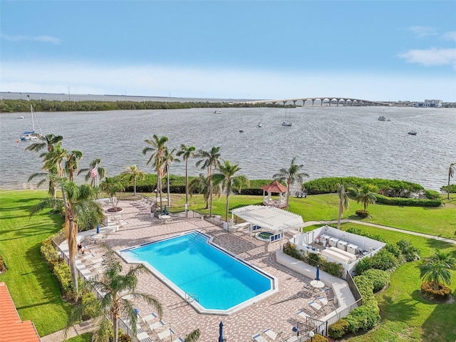 view of pool with a gazebo, a patio area, and a water view