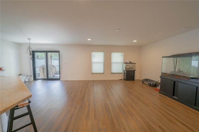 unfurnished living room featuring wood-type flooring