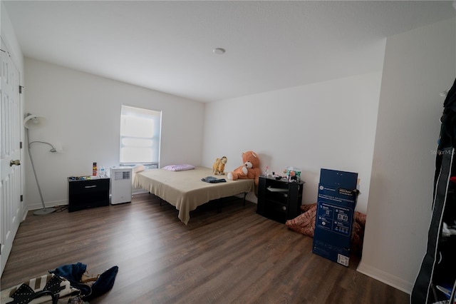 bedroom featuring dark hardwood / wood-style flooring