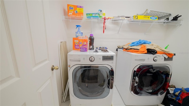 laundry area with separate washer and dryer