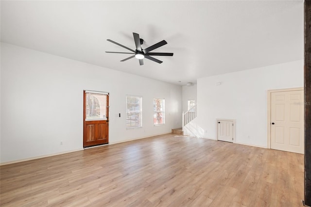 unfurnished living room with light hardwood / wood-style flooring and ceiling fan