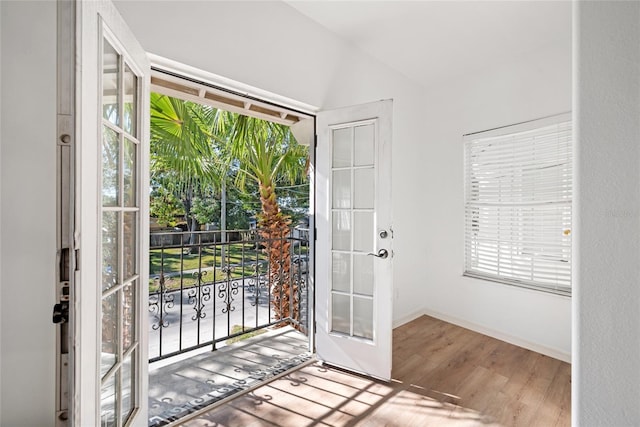 doorway with french doors and hardwood / wood-style floors