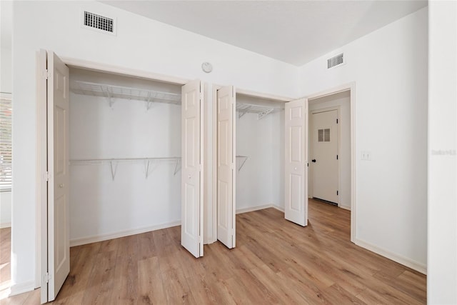 unfurnished bedroom with light hardwood / wood-style flooring