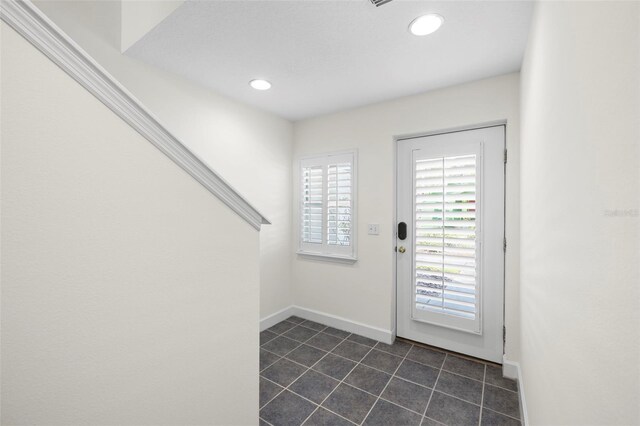 403 S Oregon Ave, Tampa, FL 33606 - doorway to outside featuring dark tile patterned flooring, baseboards, and recessed lighting