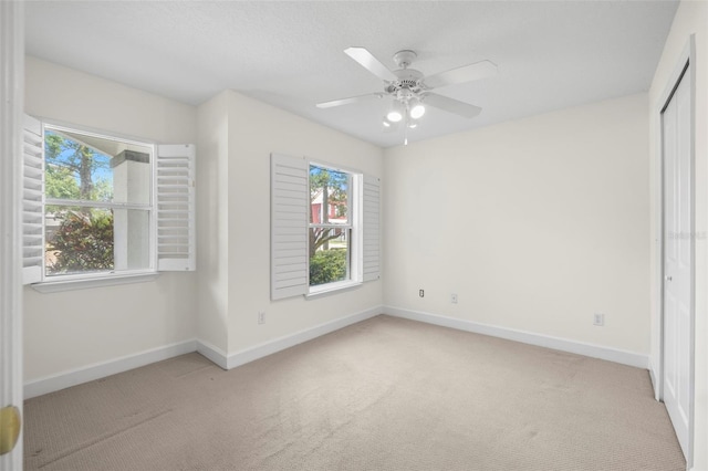 403 S Oregon Ave, Tampa, FL 33606 - unfurnished bedroom with baseboards, carpet, a closet, and ceiling fan