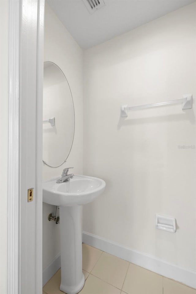 403 S Oregon Ave, Tampa, FL 33606 - bathroom featuring visible vents, tile patterned floors, baseboards, and a sink