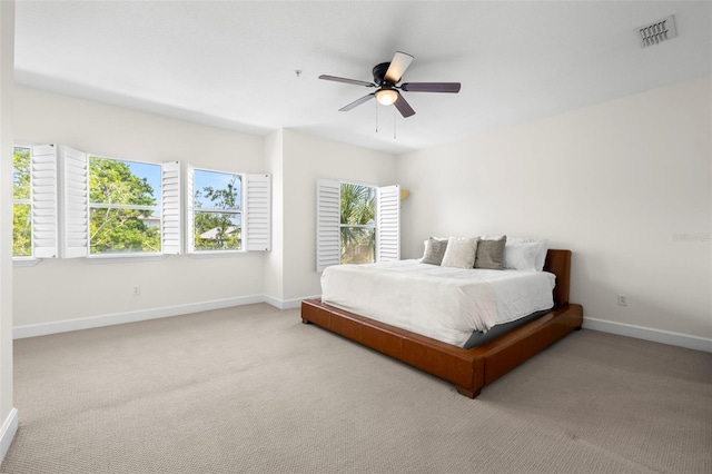 403 S Oregon Ave, Tampa, FL 33606 - carpeted bedroom with visible vents, baseboards, and multiple windows
