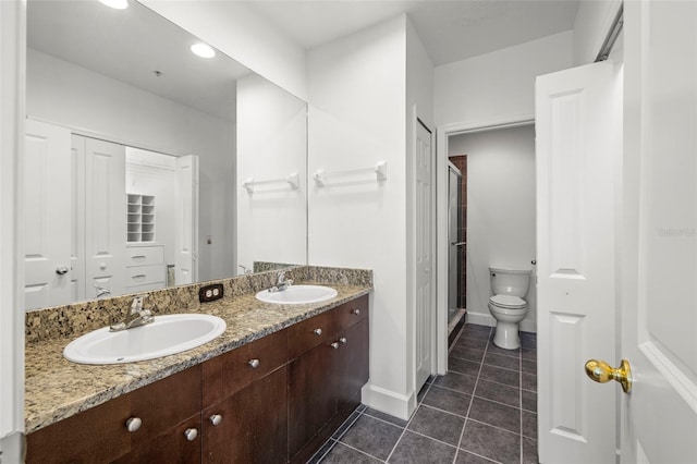 403 S Oregon Ave, Tampa, FL 33606 - full bathroom with tile patterned floors, a sink, double vanity, and toilet