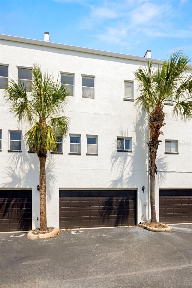 403 S Oregon Ave, Tampa, FL 33606 - view of property with aphalt driveway and a garage
