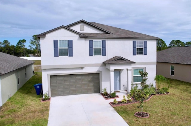 view of front of home featuring a front lawn and a garage