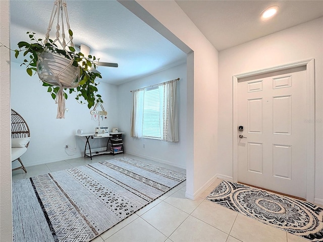 entryway with light tile patterned flooring