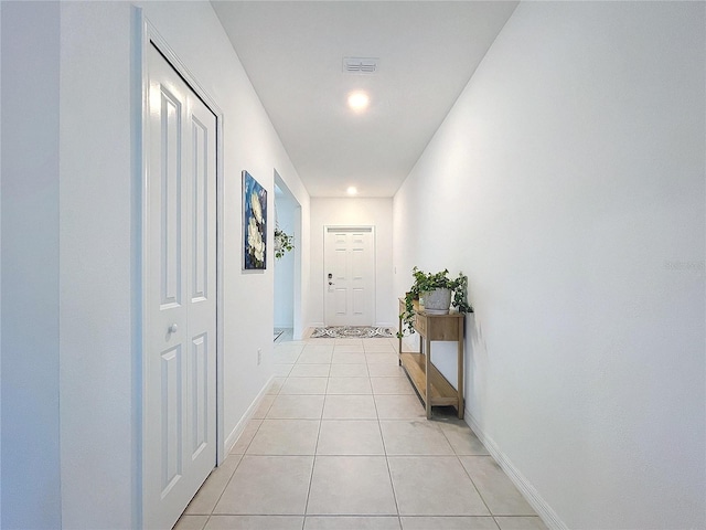 hallway with light tile patterned flooring