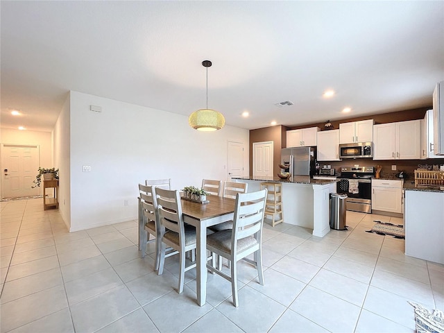 dining room with light tile patterned floors