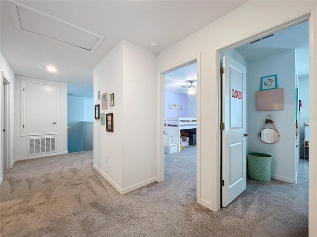 hallway featuring carpet flooring