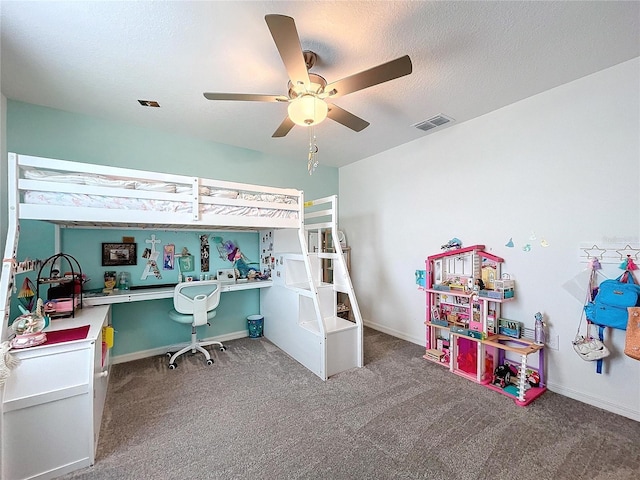 bedroom with a textured ceiling, carpet floors, and ceiling fan