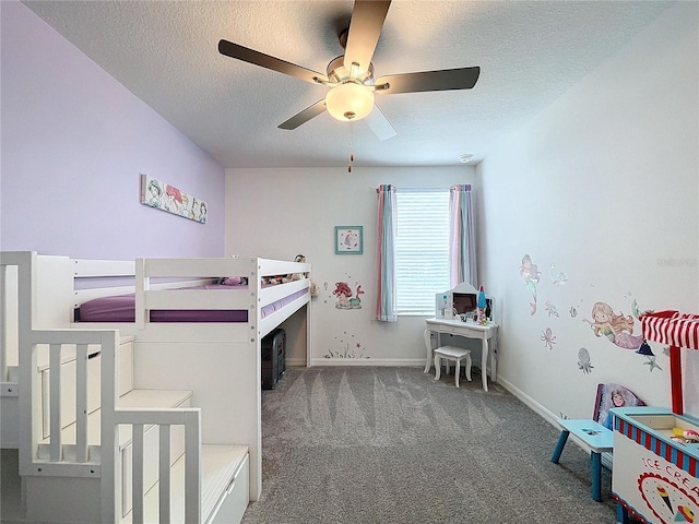 bedroom featuring carpet, ceiling fan, and a textured ceiling