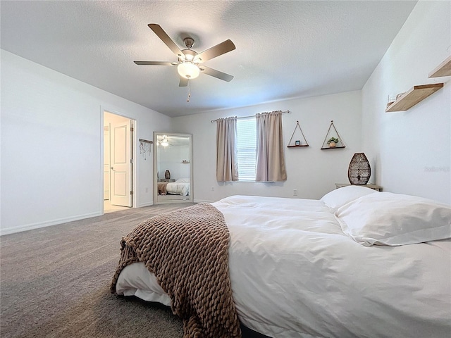 bedroom featuring ceiling fan, carpet floors, and a textured ceiling