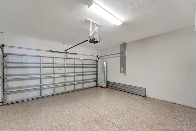 garage featuring electric panel and a garage door opener