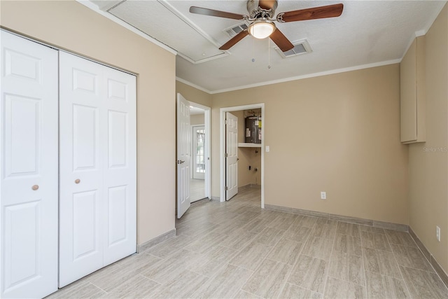 unfurnished bedroom with ceiling fan, a closet, light hardwood / wood-style flooring, and ornamental molding