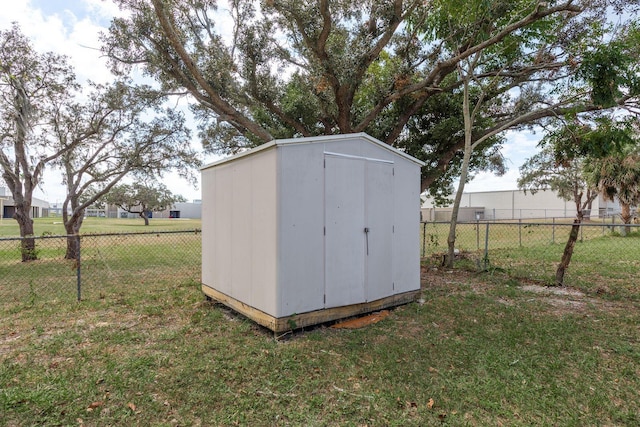 view of outbuilding with a yard