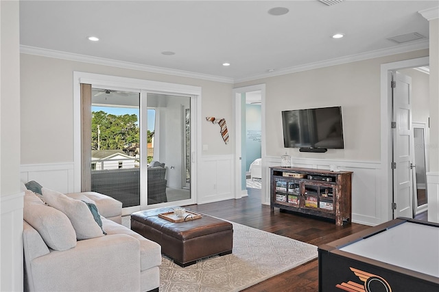 living room featuring crown molding and dark hardwood / wood-style flooring