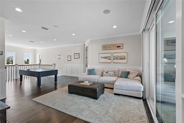 recreation room featuring wood-type flooring and ornamental molding