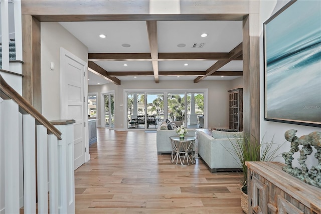 living room featuring beam ceiling, light hardwood / wood-style floors, and coffered ceiling