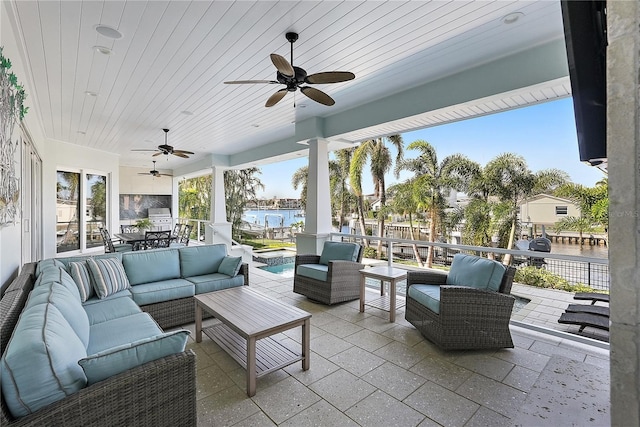 view of patio / terrace with outdoor lounge area and a water view