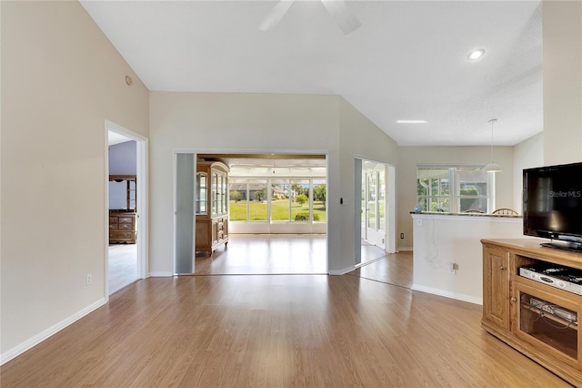 unfurnished living room with light wood-type flooring and ceiling fan