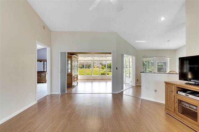 719 Winterbrooke Way, Sun City Center, FL 33573 - living room with light wood-type flooring, baseboards, a ceiling fan, and recessed lighting