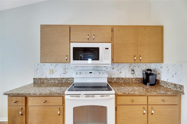 kitchen with a textured ceiling, lofted ceiling, tasteful backsplash, and white appliances