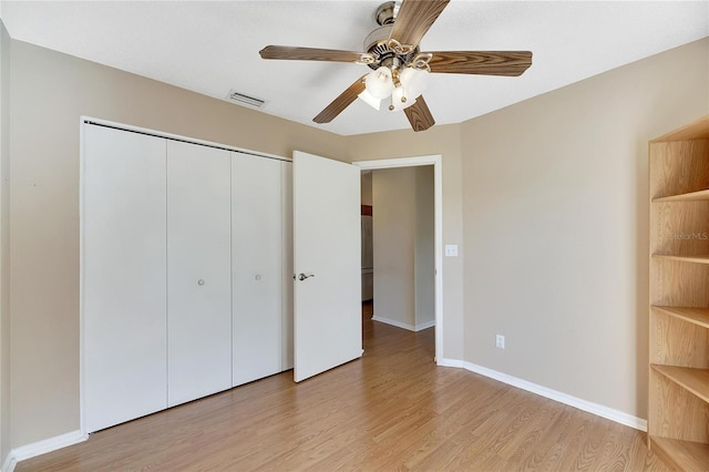 unfurnished bedroom featuring a closet, ceiling fan, and light hardwood / wood-style floors