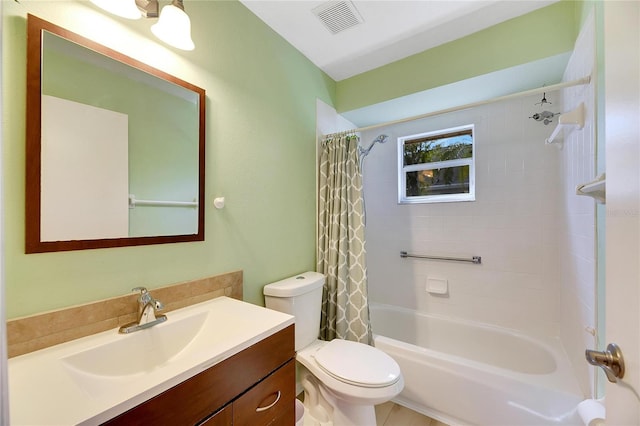 full bathroom featuring shower / bath combo, vanity, and toilet